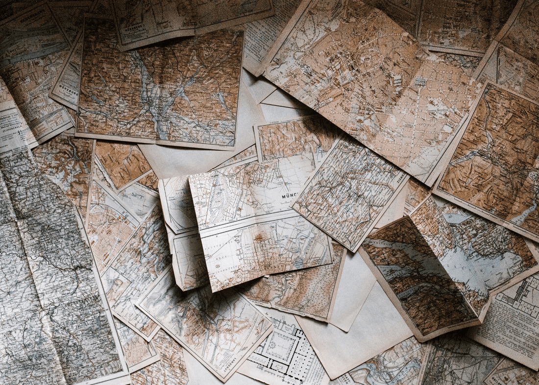 a collection of paper maps