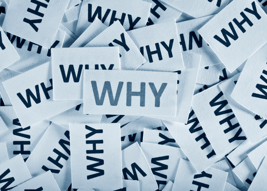 the word "why" on paper over and over