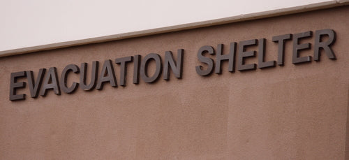 picture of a sign that states evacuation shelter
