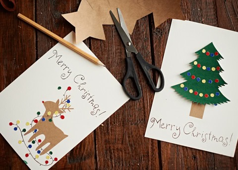Christmas cards on a wood table - HANDMADE Christmas cards..with with reindeer and the other with a Christmas tree