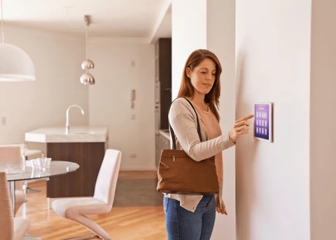 a woman setting her alarm system