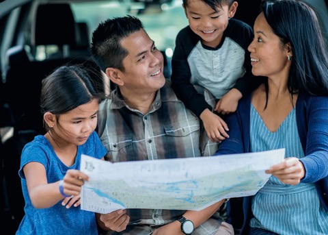 family looking at a map
