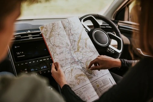 looking at a map inside a car