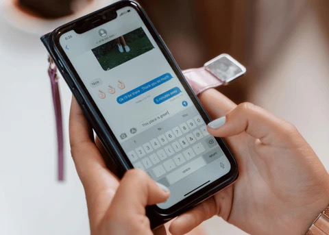 a woman texting on her cell phone