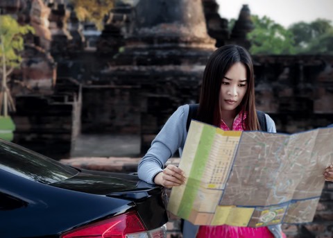 a woman looking a map