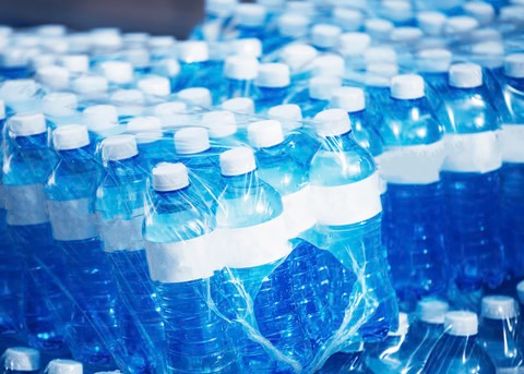 bottles of water packaged in groups for purchase