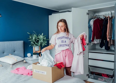 woman sorting through her closet