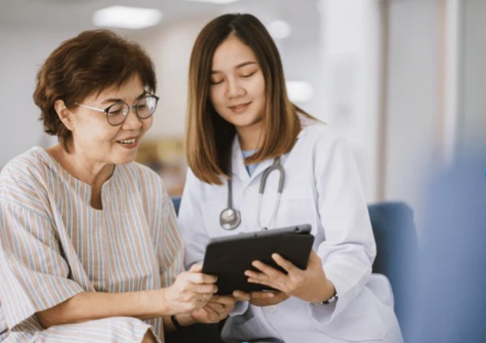 a woman going over medical results with her physician